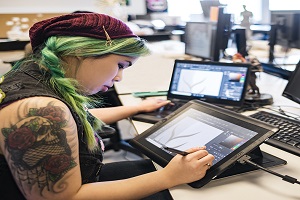 Game designer working on tablet